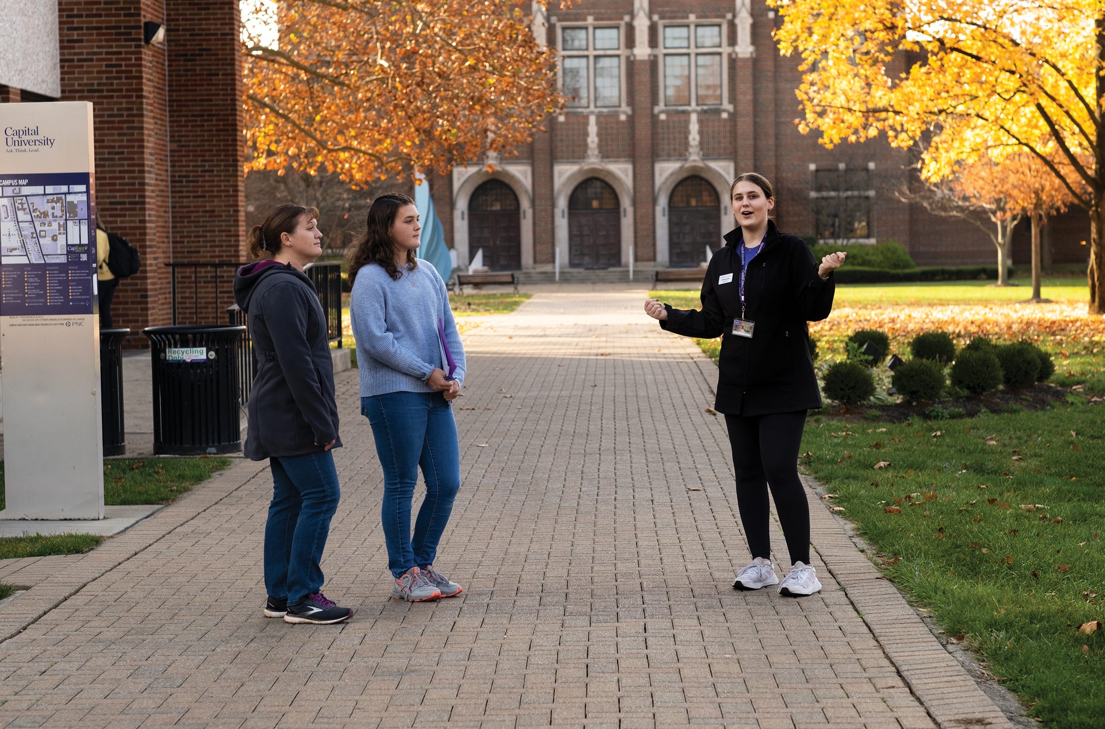 Adeline Thorn and her mother, Melissa Thorn, of Smithville, Ohio, explore Capital University with student tour guide Corinne Gorgas.