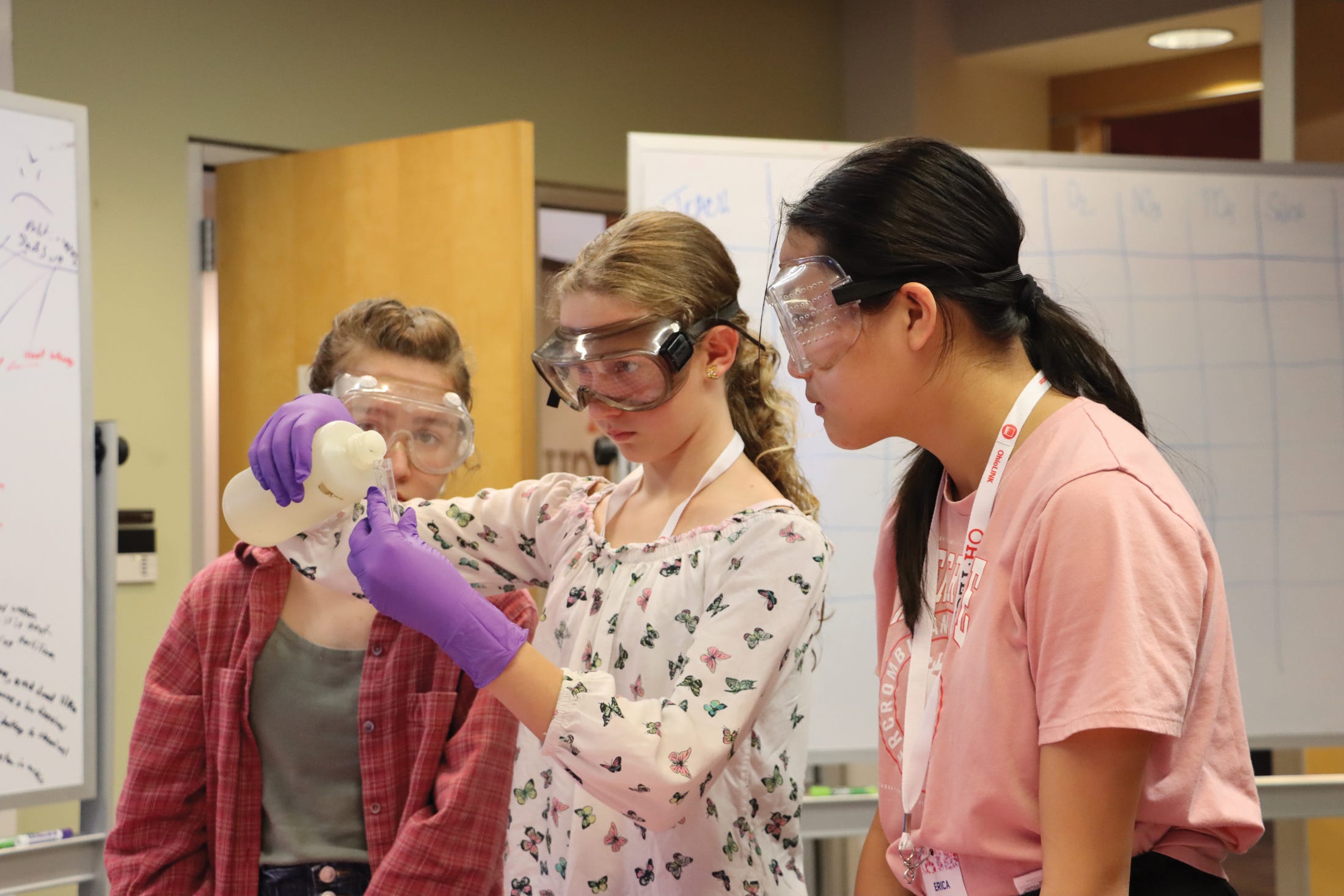 Students at the Ohio Supercomputer Center’s Young Women’s Summer Institute work with water-quality testing kits.