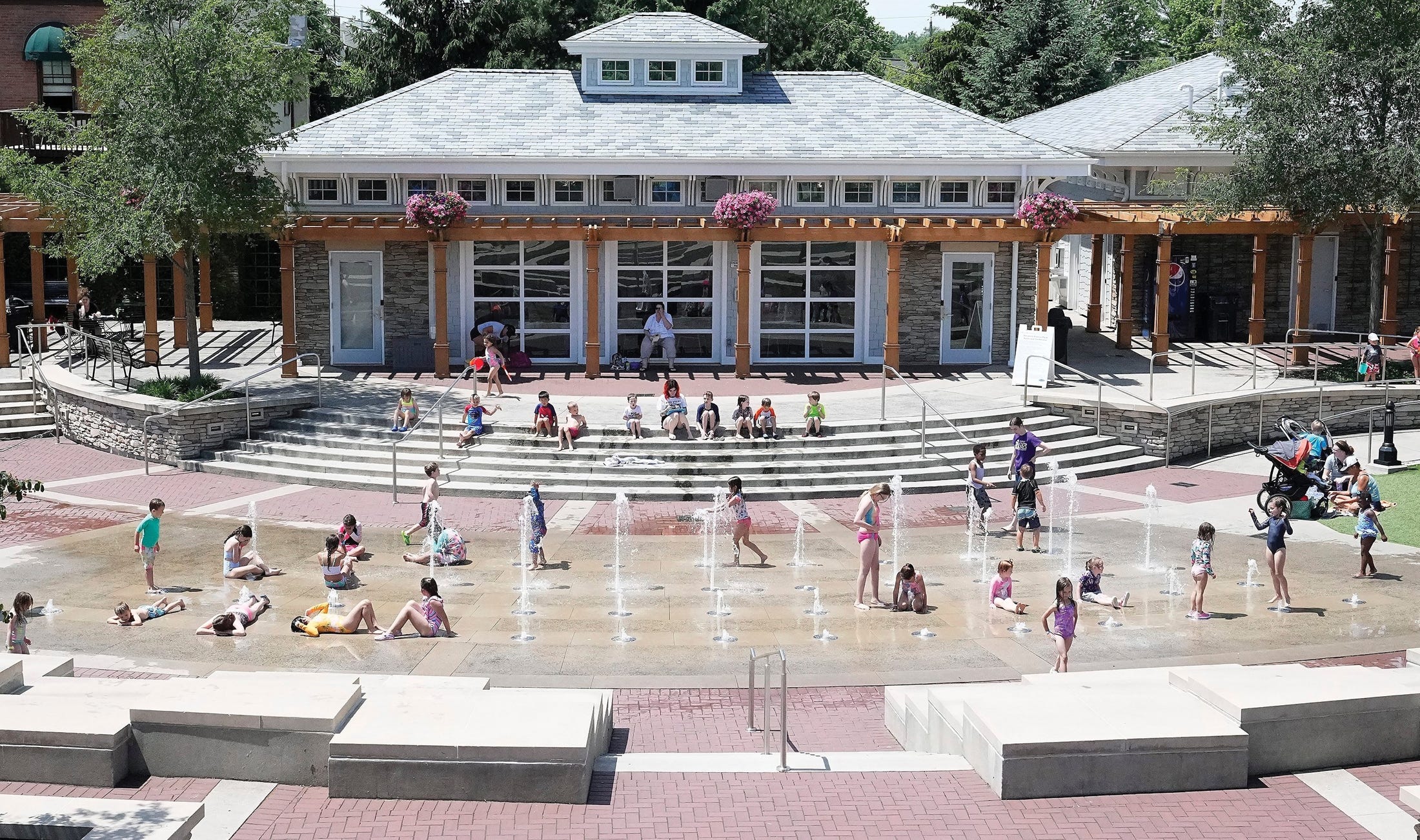 Children enjoy the splash pad at Hilliard’s Station Park